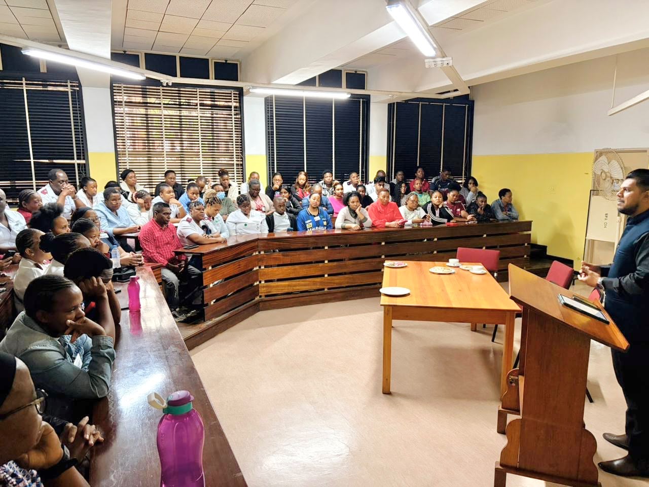 Avishek Busviah presenting to a lecture hall audience