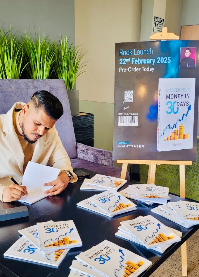 Avishek Busviah signing copies of his book